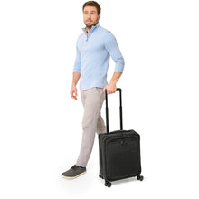 Load image into Gallery viewer, Briggs & Riley Baseline Compact Carry On Spinner - lifestyle wheeling
