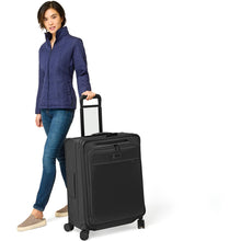 Load image into Gallery viewer, Briggs & Riley Baseline Medium Expandable Spinner - lifestyle wheeling